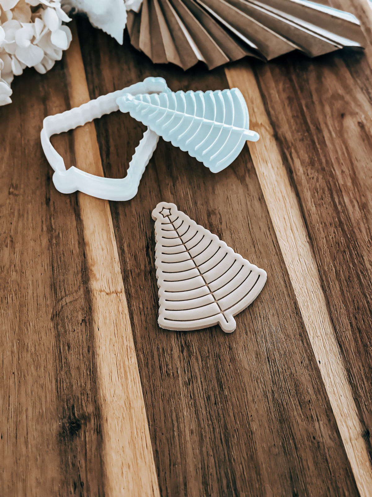 Simple Star Christmas Tree cookie stamp and cutter by O'Khach, shown stamped in fondant