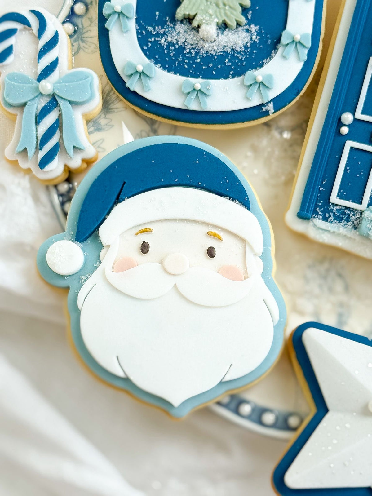 Mr. Santa design stamped in fondant to show the finished cookie