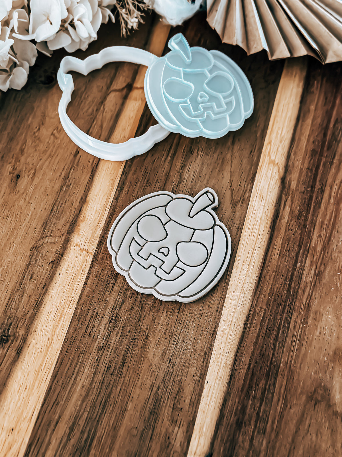Scary Pumpkin Halloween cookie stamp and cutter by O'Khach, shown stamped in fondant
