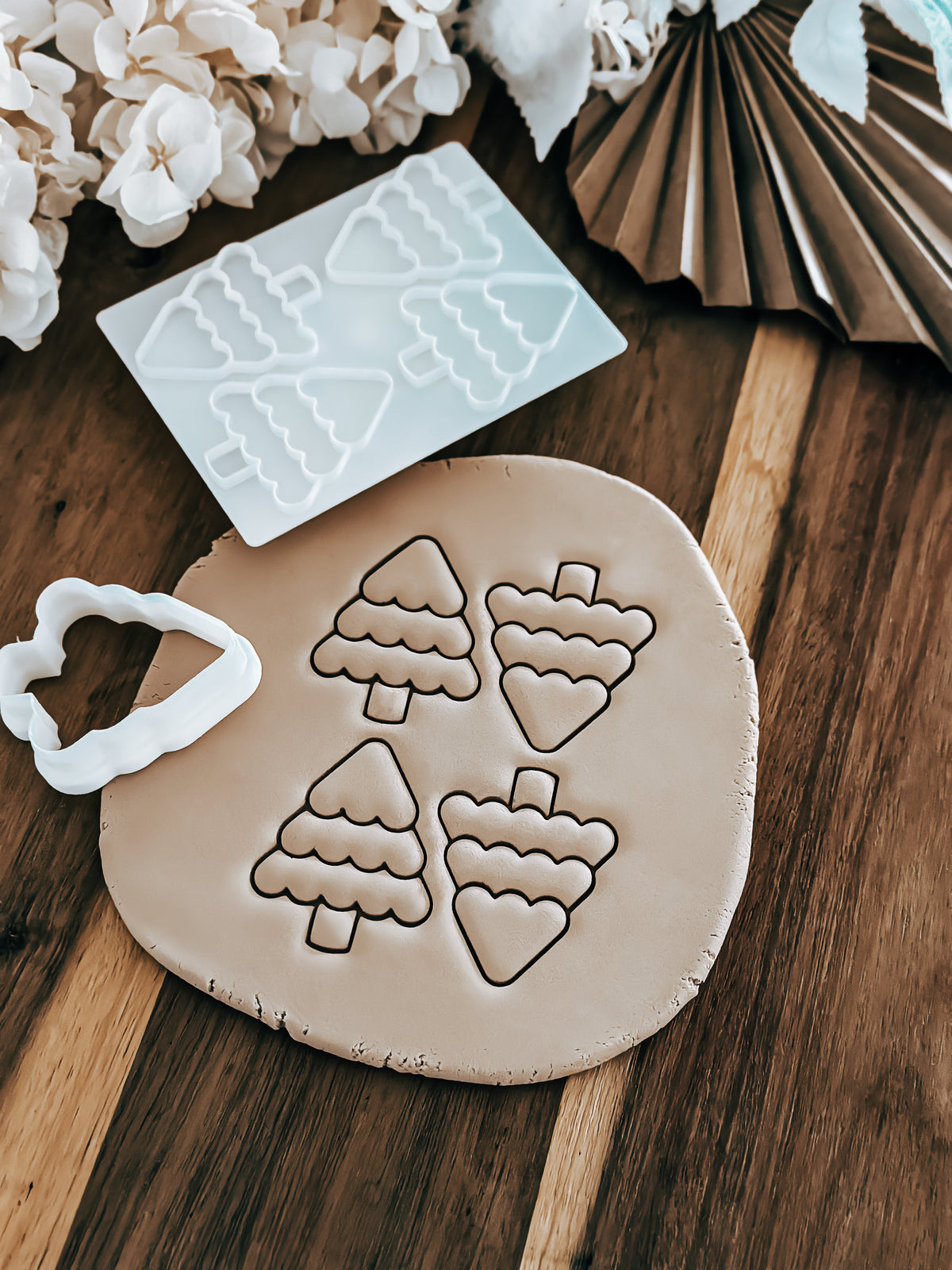 Mini Multi - Christmas Tree cookie stamp and cutter by O'Khach, shown stamped in fondant