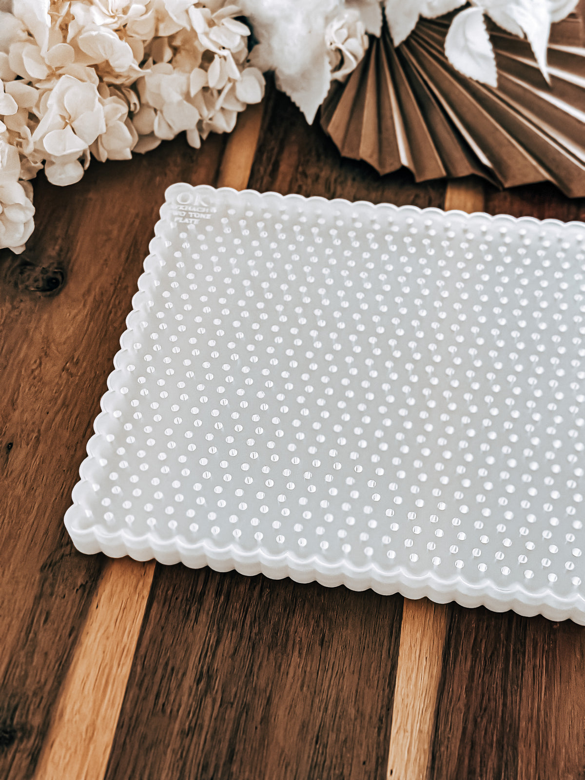 Large Two Tone Plate by O'Khach, 22 x 15.5cm white plate with scalloped edges and engraved logo