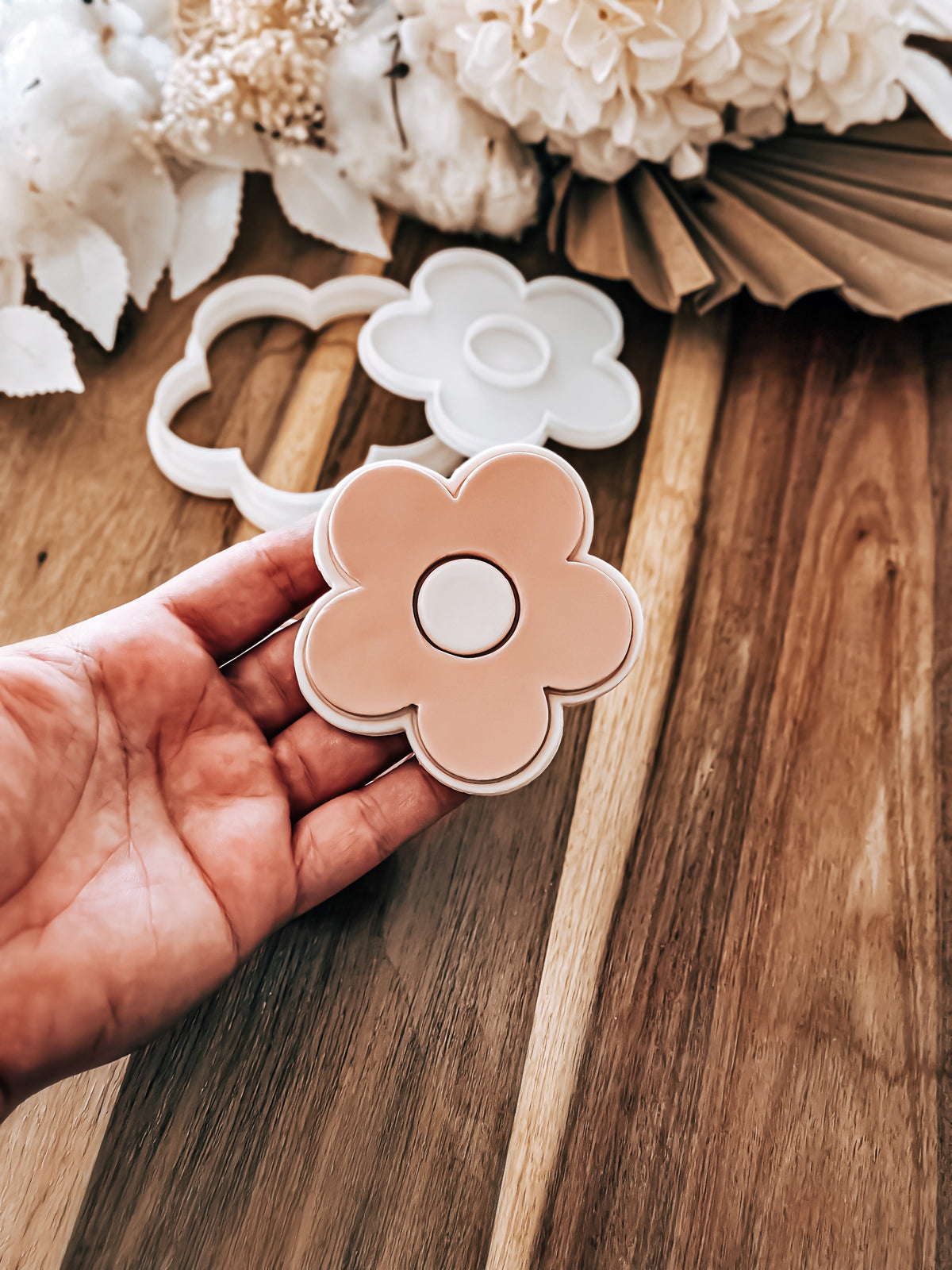 Simple Daisy cookie stamp and cutter by O'Khach, shown stamped in fondant