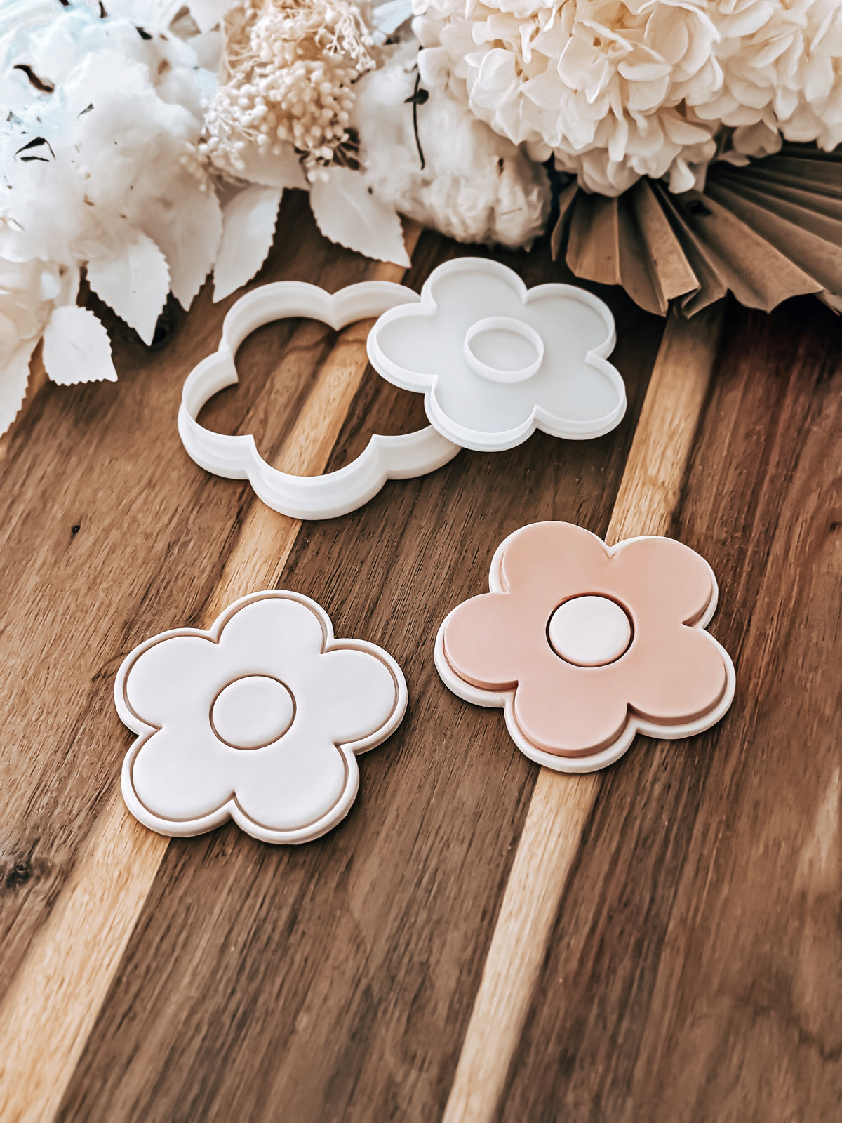 Simple Daisy design stamped in fondant to show the finished cookie