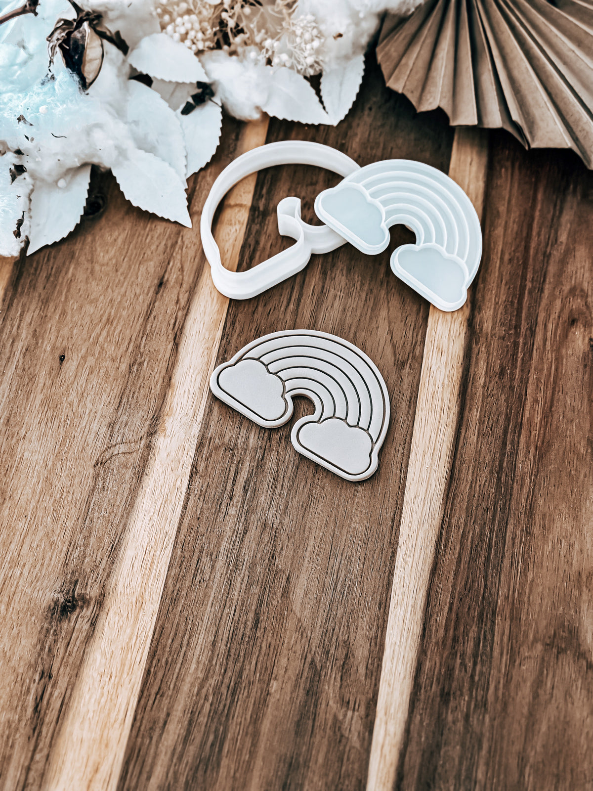 Rainbow cookie stamp and cutter by O'Khach, shown stamped in fondant