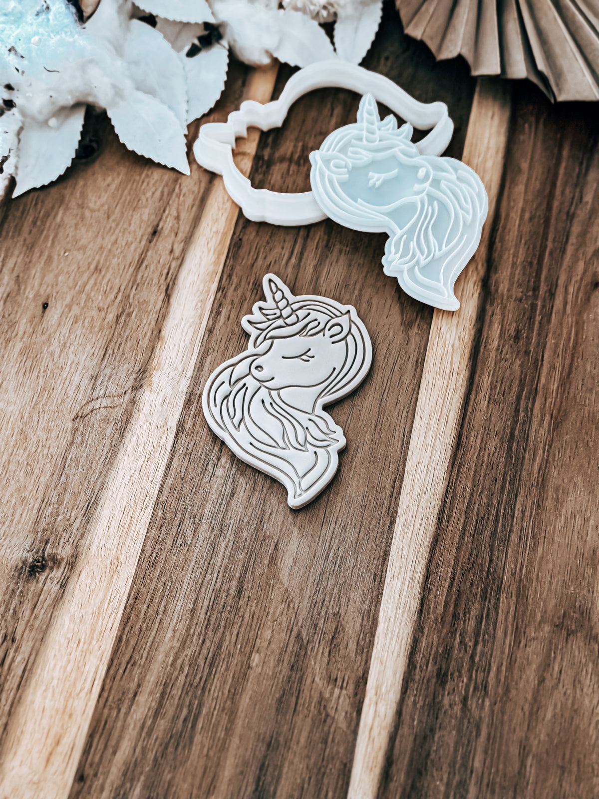 Glitter The Unicorn cookie stamp and cutter by O'Khach, shown stamped in fondant
