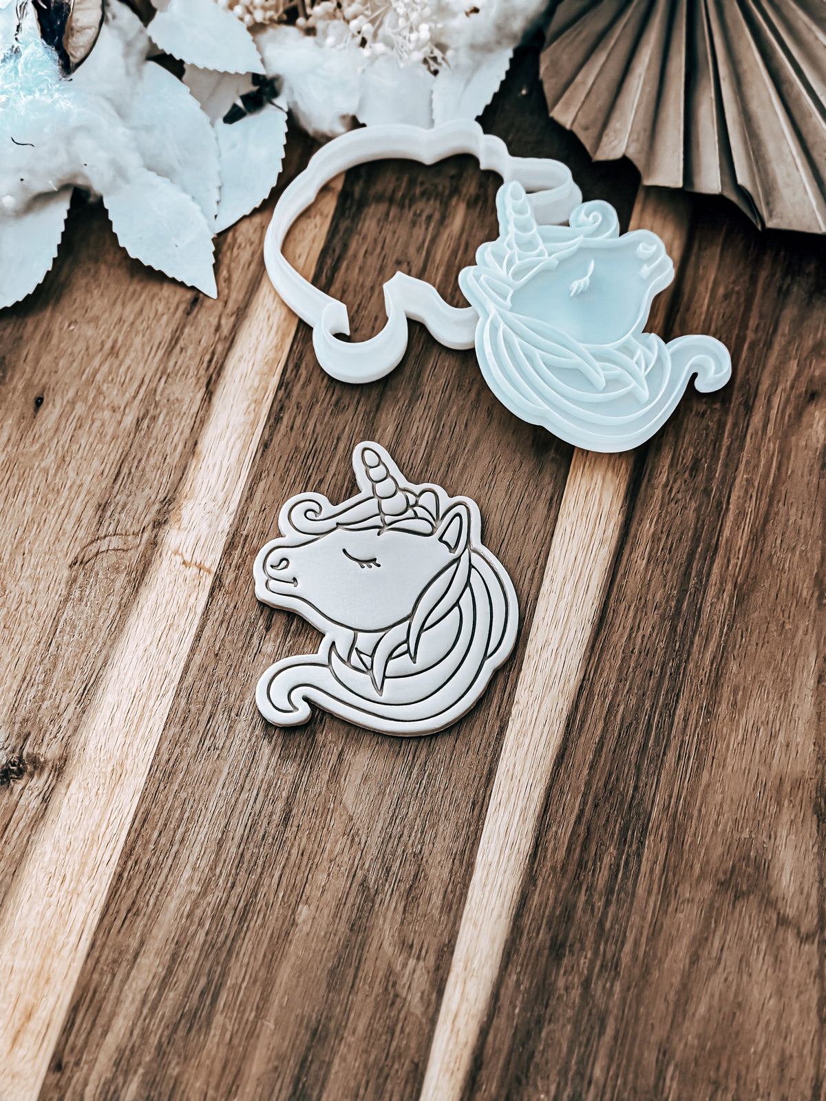 Unicorn cookie stamp and cutter by O'Khach, shown stamped in fondant