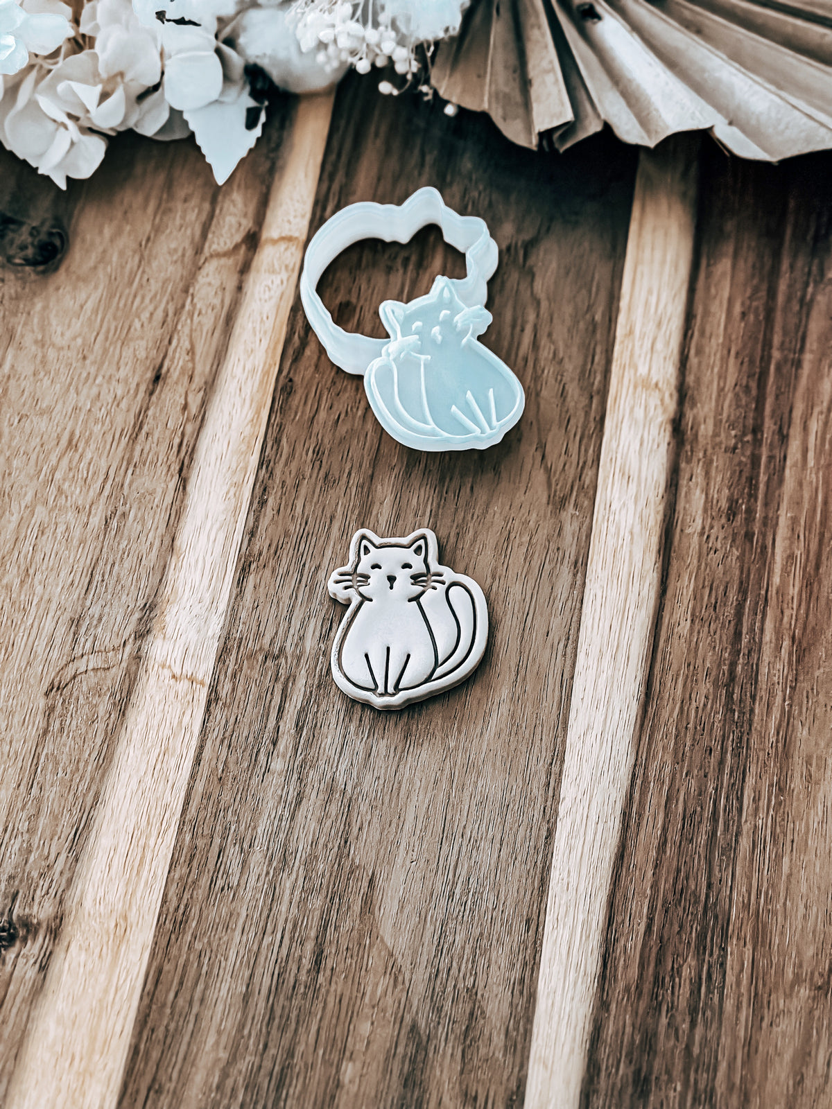 One of the Mini Cat designs stamped in fondant, view 2
