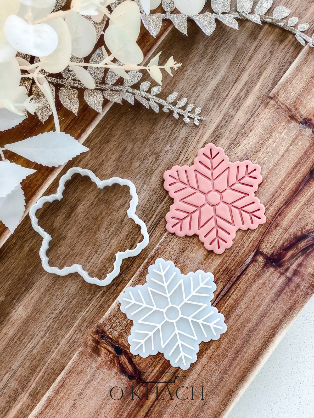 Bella Snowflake Christmas cookie stamp and cutter by O'Khach, shown stamped in fondant