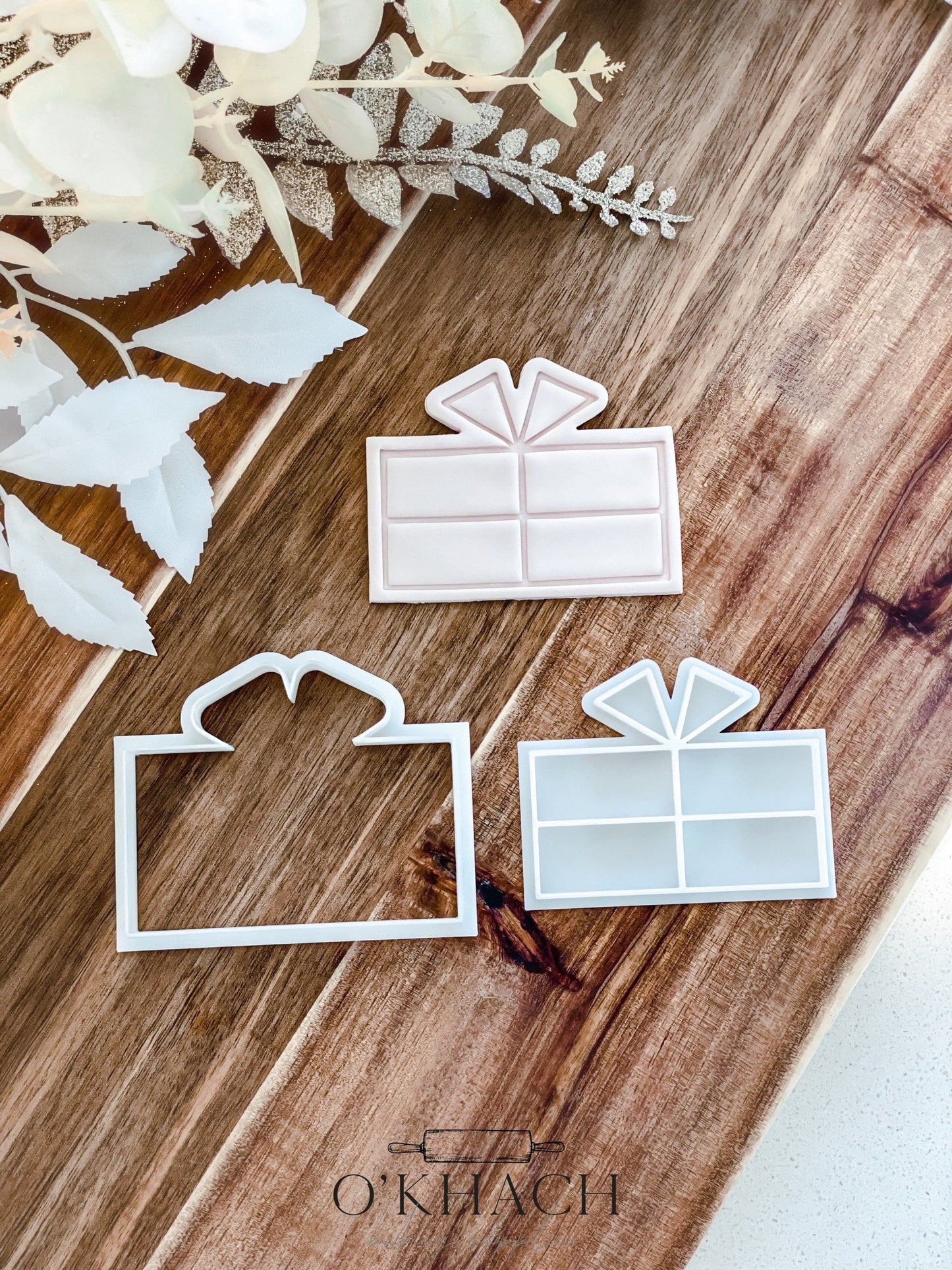 Christmas Present cookie stamp and cutter by O'Khach, shown stamped in fondant