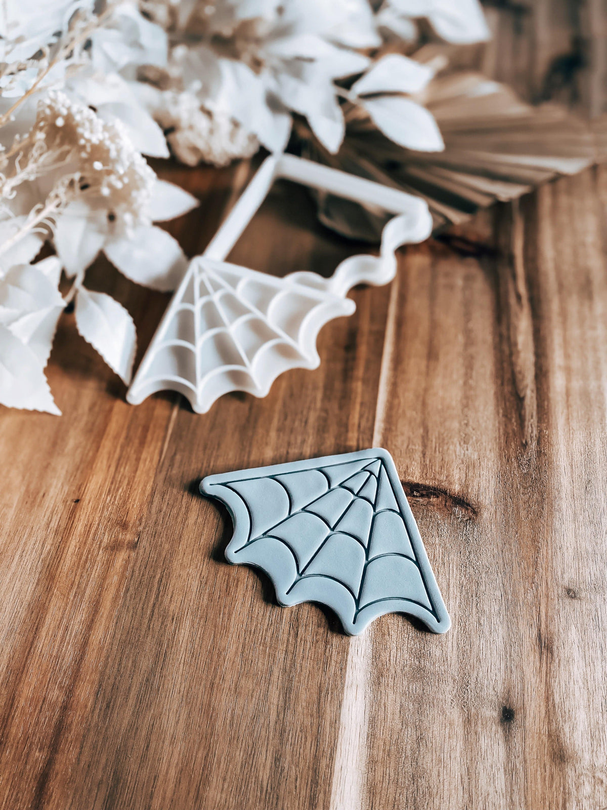 Corner Web Halloween cookie stamp and cutter by O'Khach, shown stamped in fondant