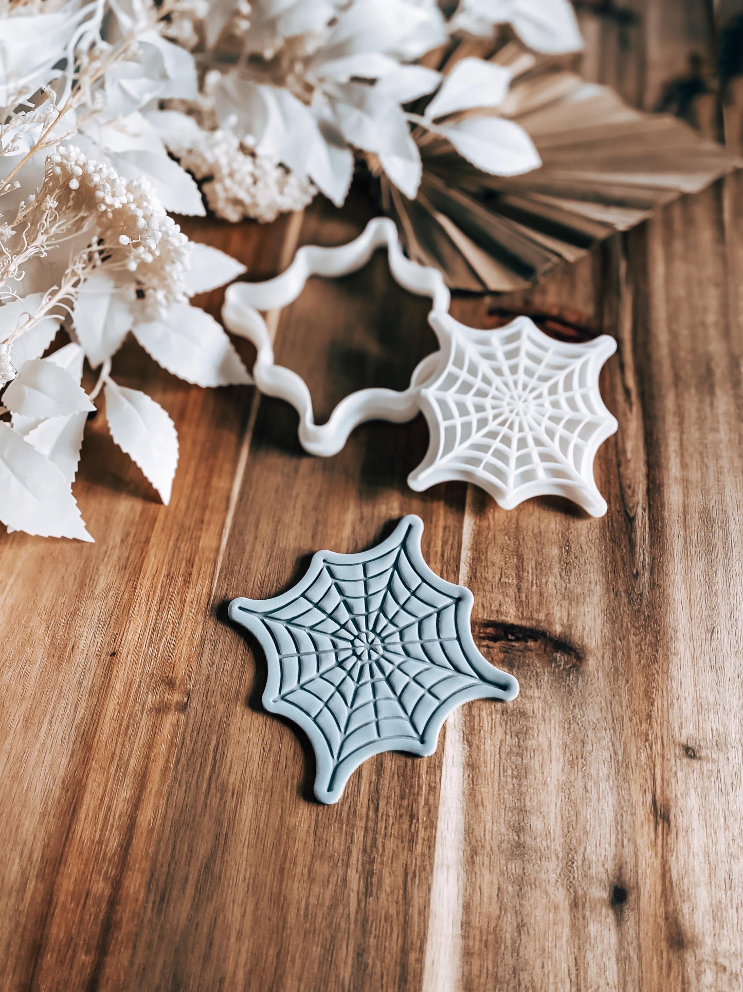 Full Web Halloween cookie stamp and cutter by O'Khach, shown stamped in fondant