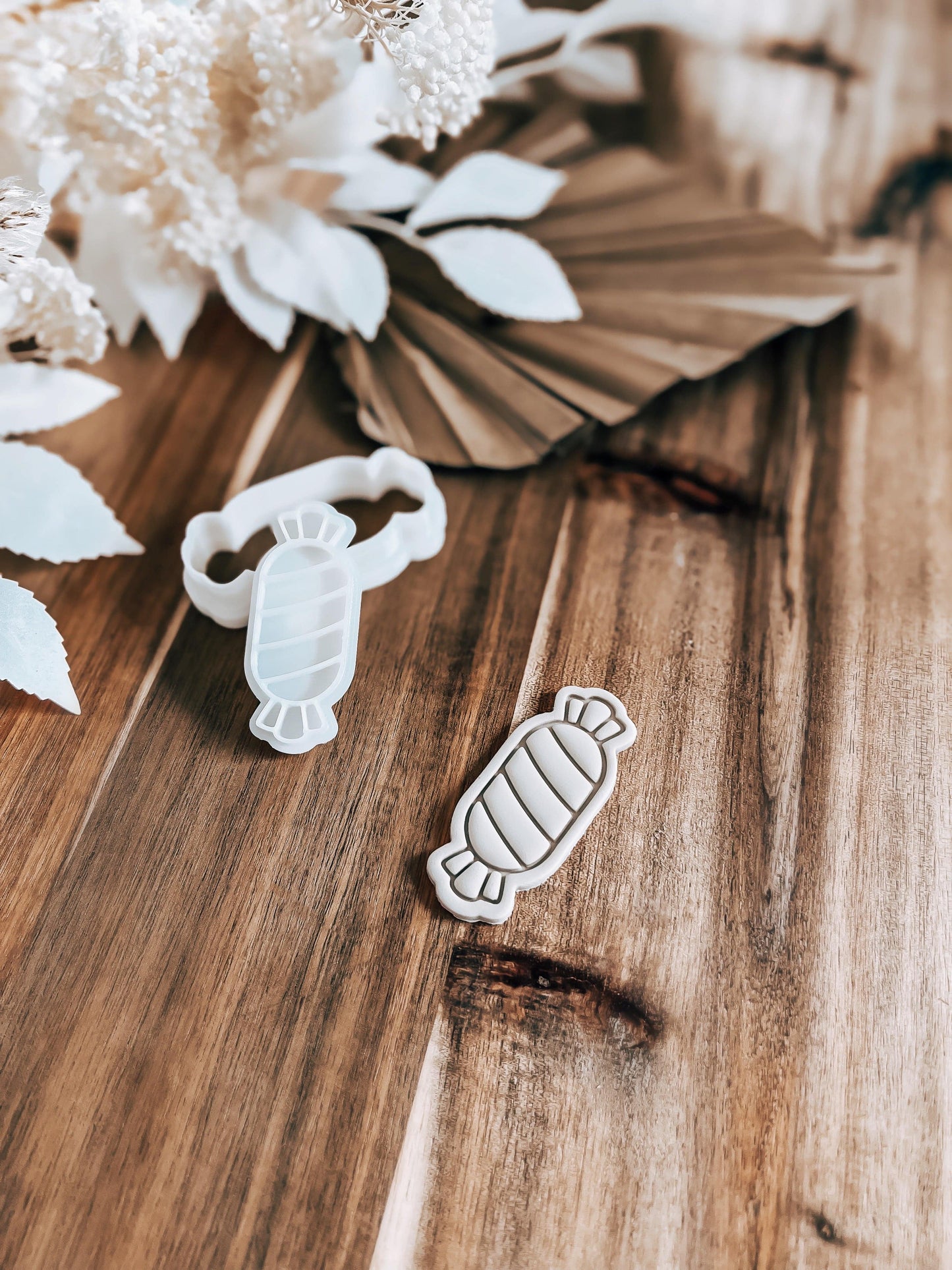 Mini Lolly cookie stamp and cutter by O'Khach, shown stamped in fondant
