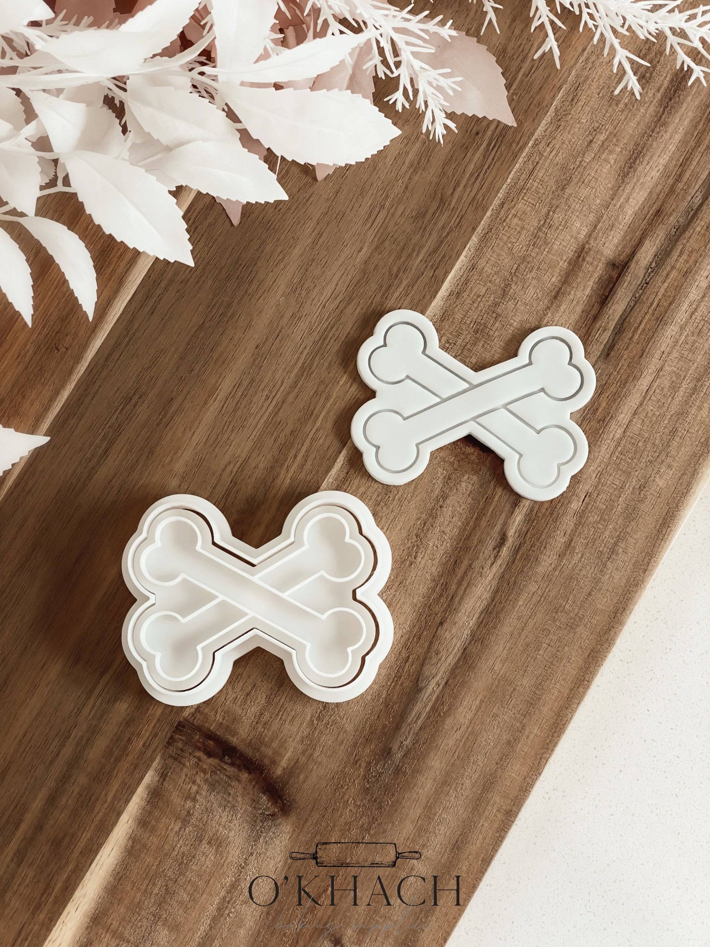Cross Bones Halloween cookie stamp and cutter by O'Khach, shown stamped in fondant