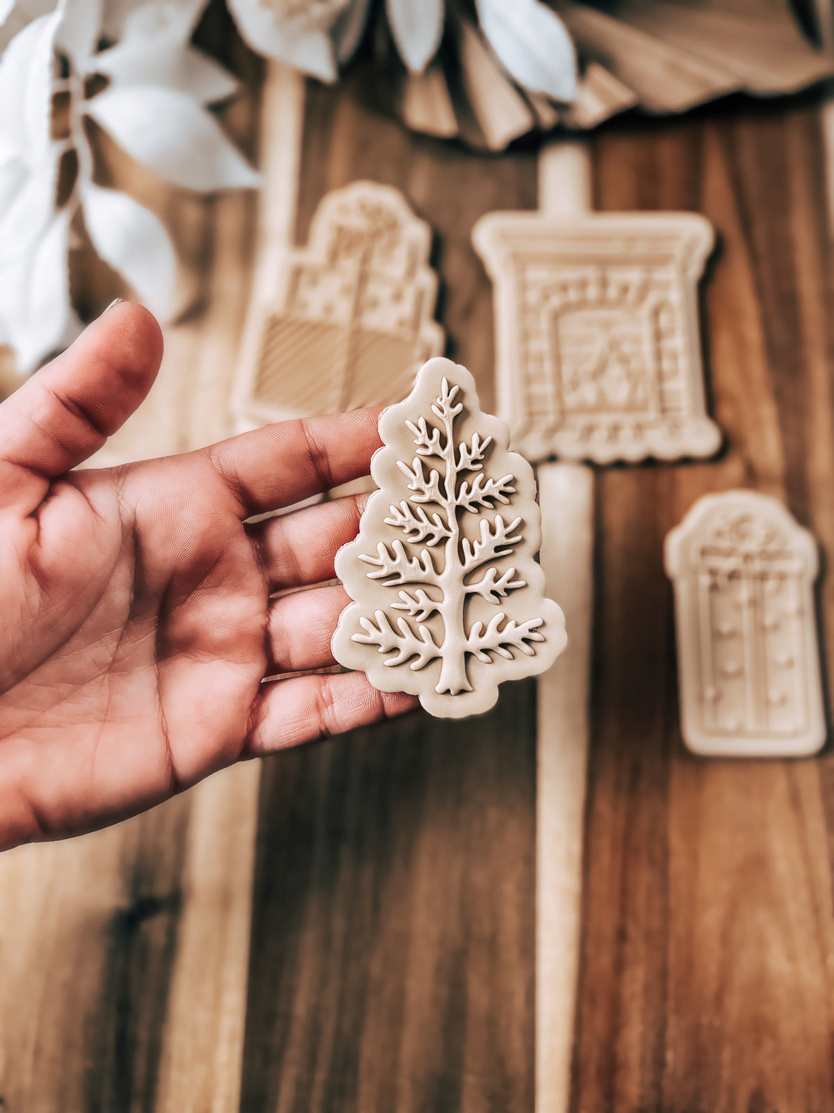 Christmas Tree 'UP' cookie stamp and cutter by O'Khach, shown stamped in fondant