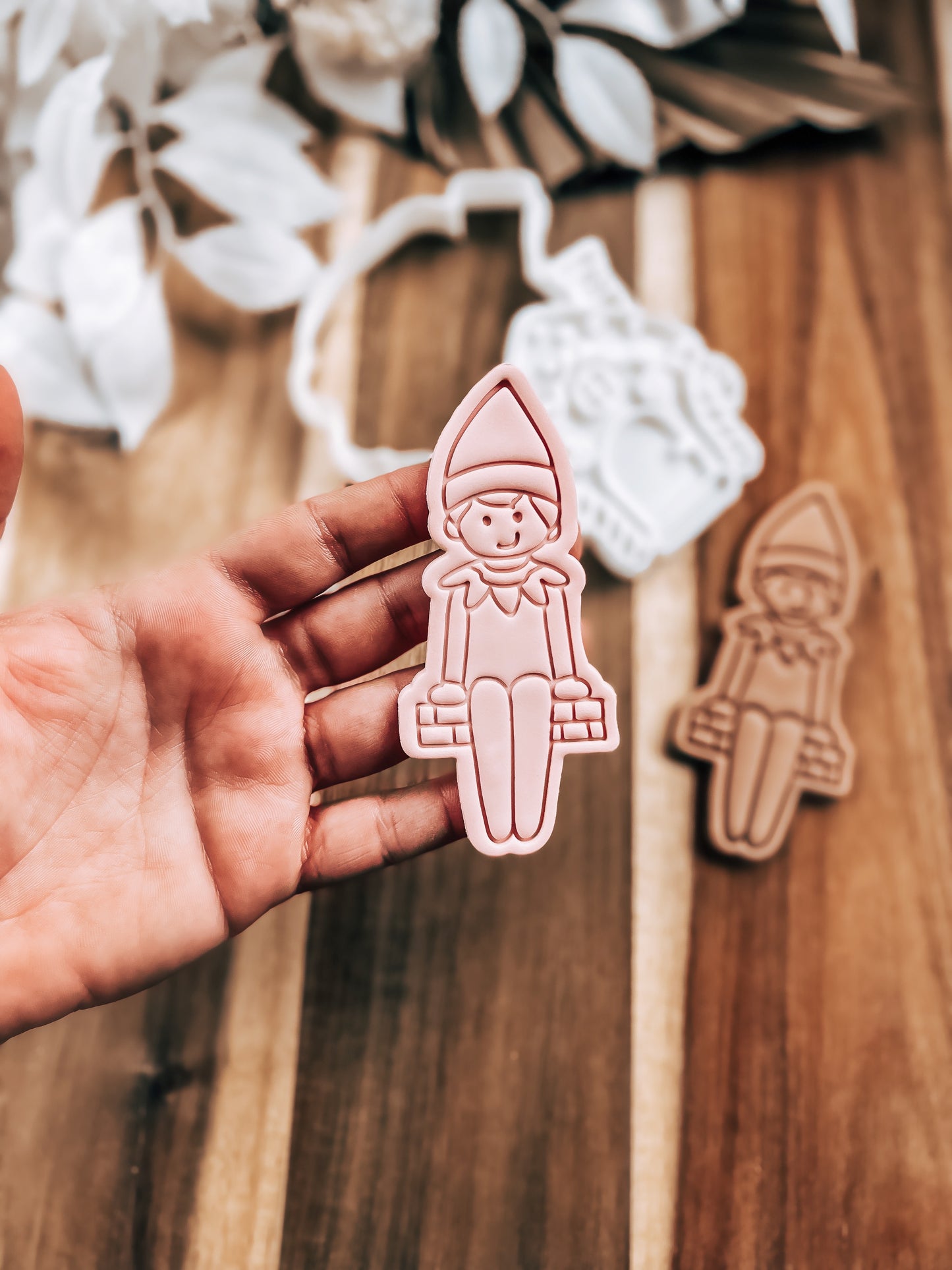 Cheeky Elf Christmas cookie in fondant, close up