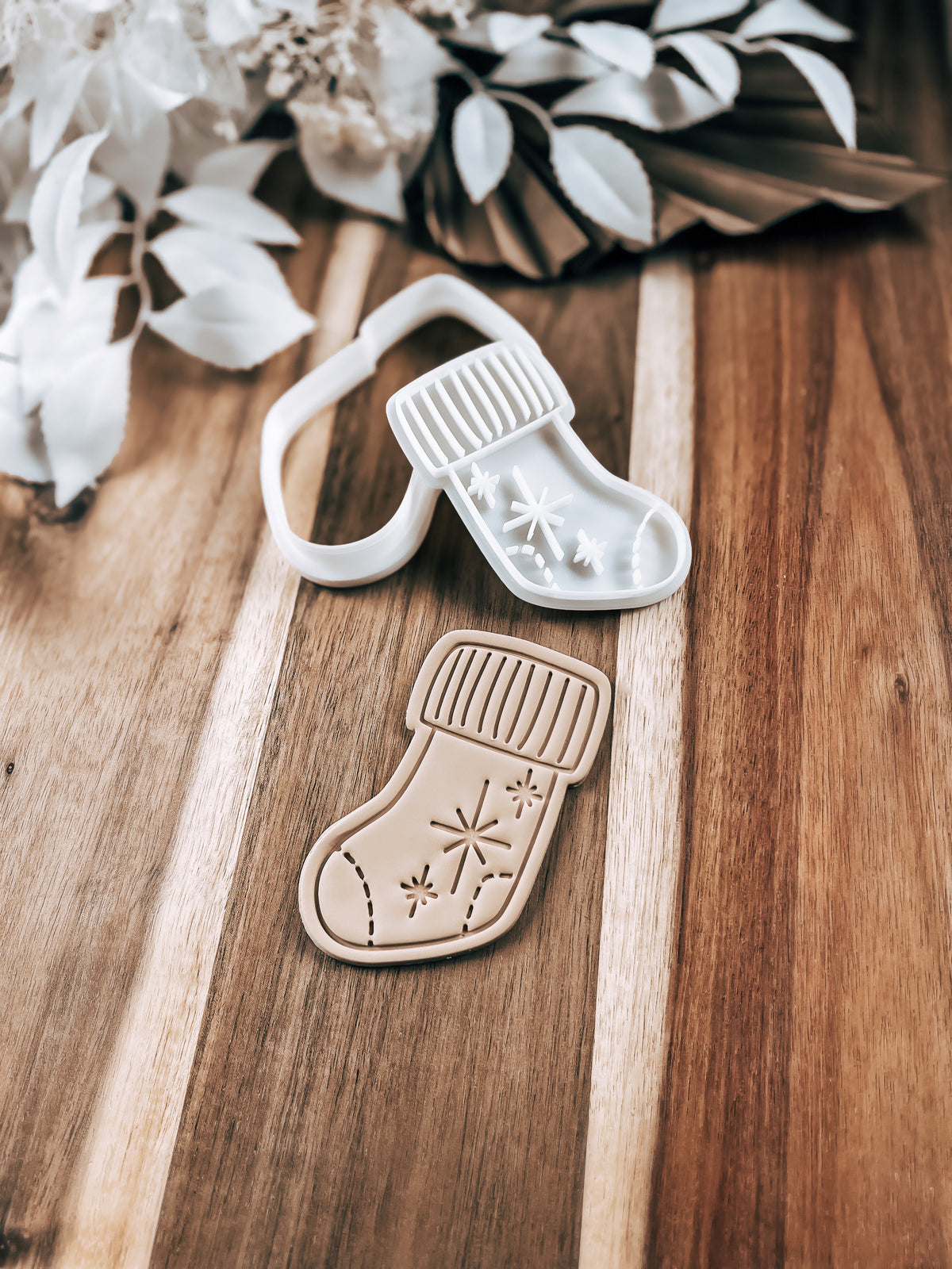 Star Stocking Christmas cookie stamp by O'Khach, shown stamped in fondant
