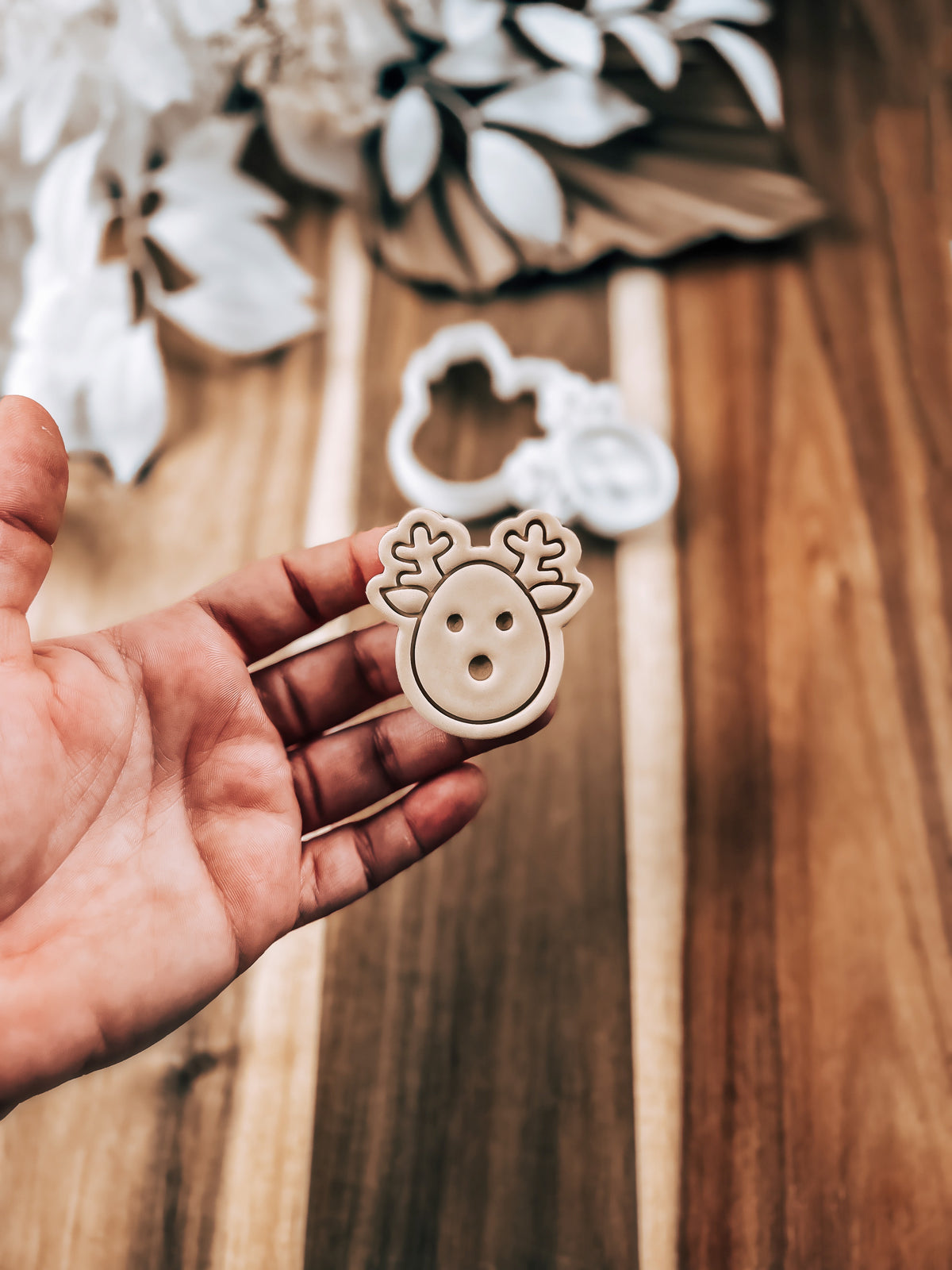 Mini Reindeer Christmas cookie stamp and cutter by O'Khach, shown stamped in fondant
