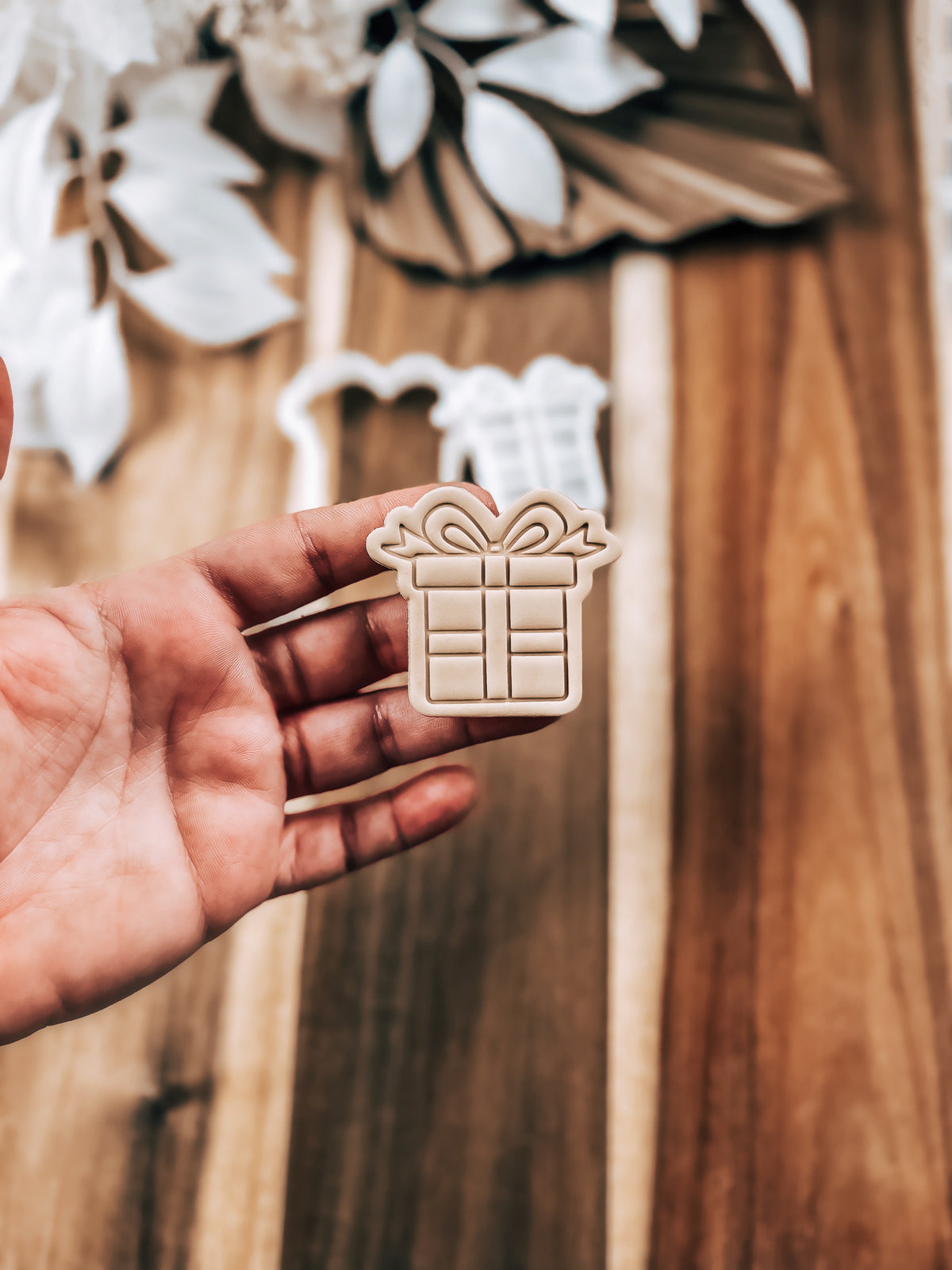 Mini Present Christmas cookie stamp and cutter by O'Khach, shown stamped in fondant