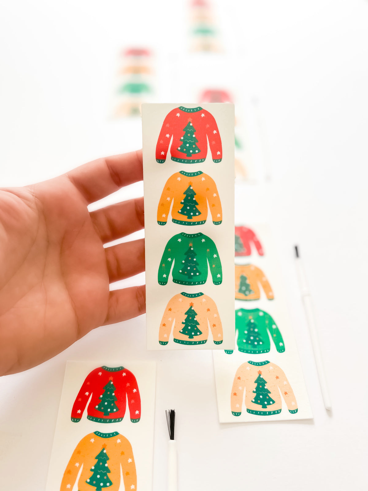 Christmas Sweater Paint Your Own cookie painted with an O'Khach edible paint palette