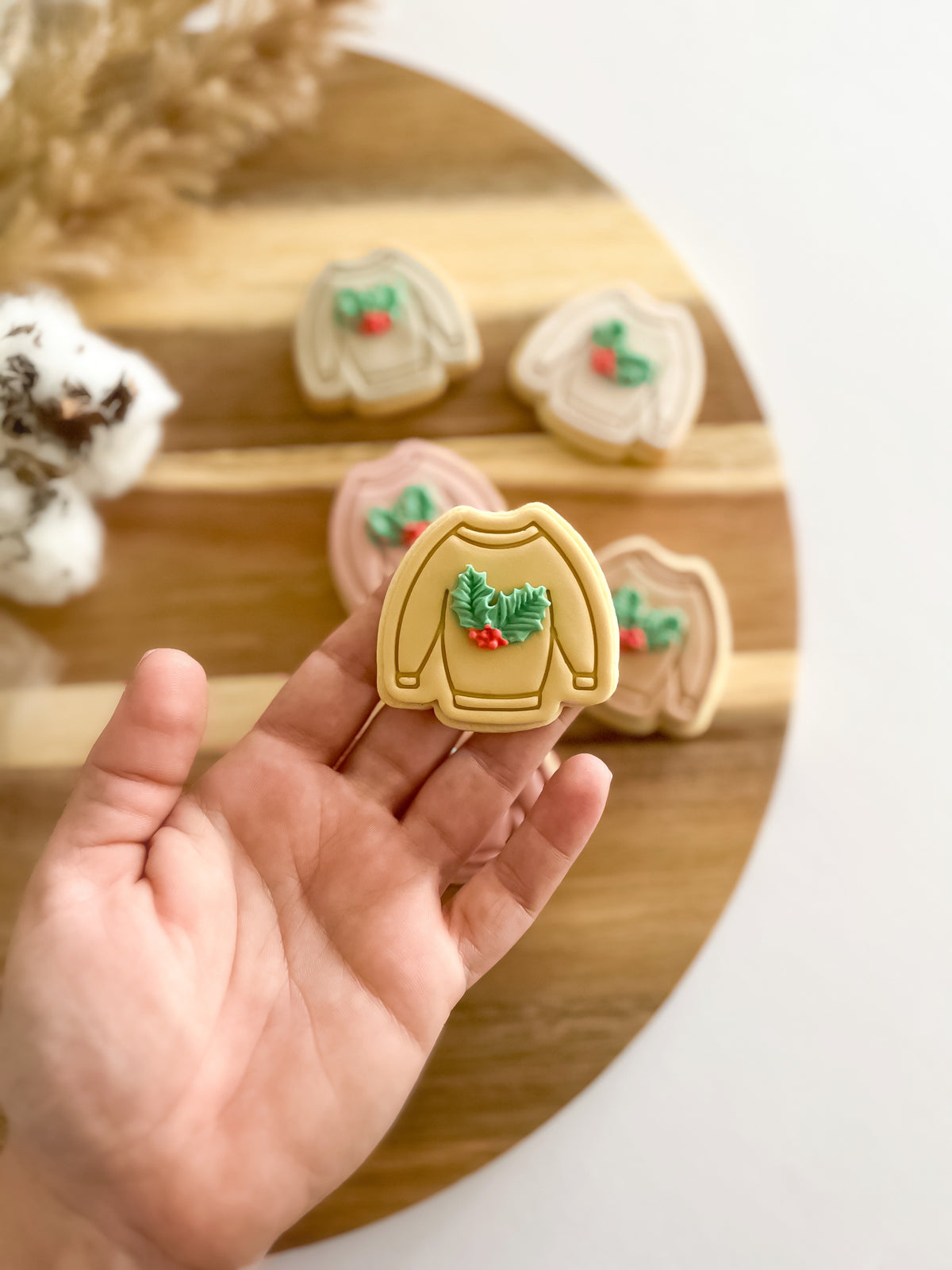 Mini Sweater design stamped in fondant to show the finished cookie