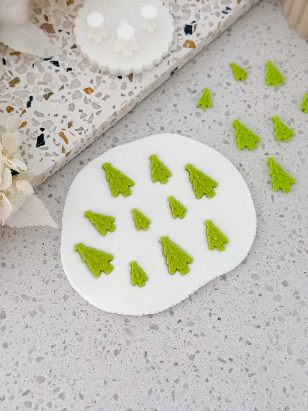 Green fondant Christmas trees made with the Two Tone Press mould by O'Khach Baking Supplies