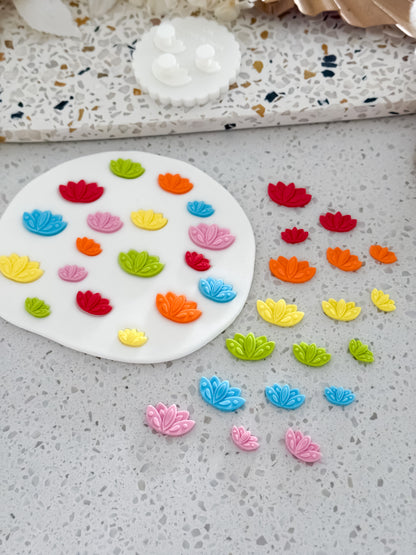 Rainbow lotus flower fondant pieces in three sizes made with the Lotus Flower Two Tone Press mould by O'Khach Baking Supplies